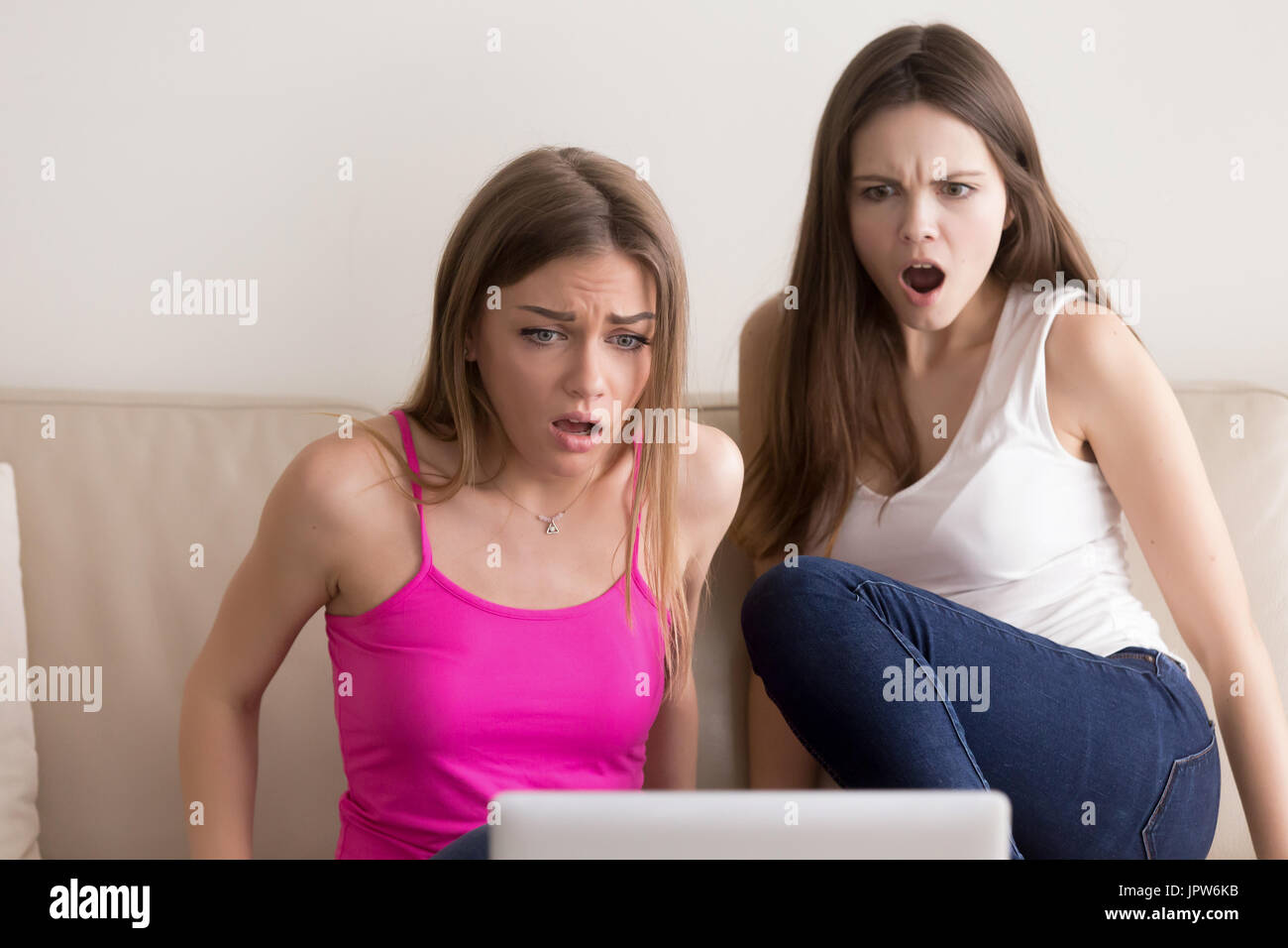 Ladies surprised with shocking movie plot twist Stock Photo