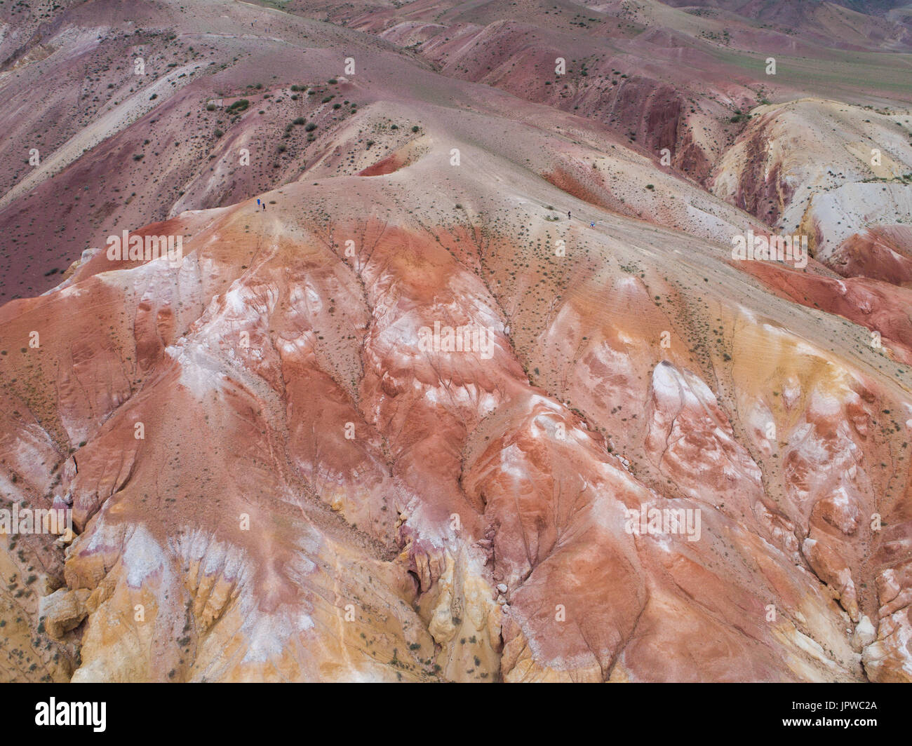 Aerial top down view on Zhangye Rainbow mountains displaying colorful pattern. Stock Photo