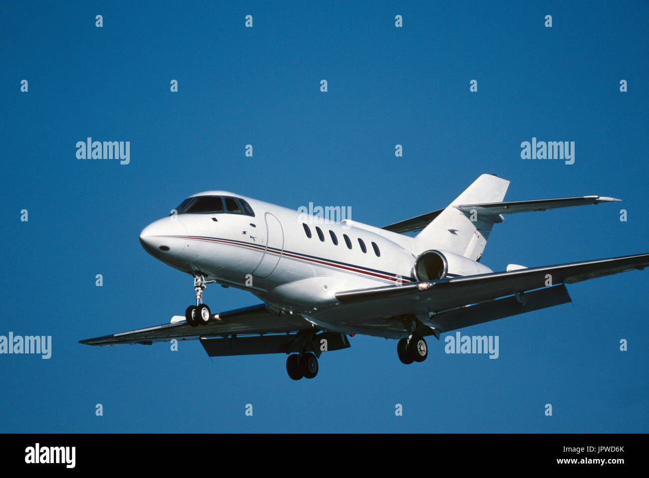 Hawker 800 business-jet on final-approach with flaps deployed Stock Photo