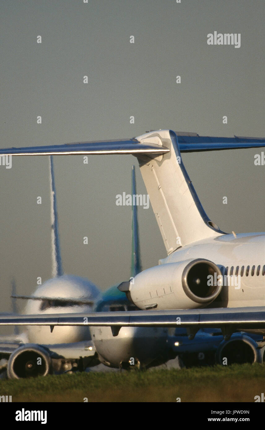 Tail Fin Of A Mcdonnell Douglas Md 80 Boeing 737 And A 767 Queue To Take Off Behind Stock Photo Alamy