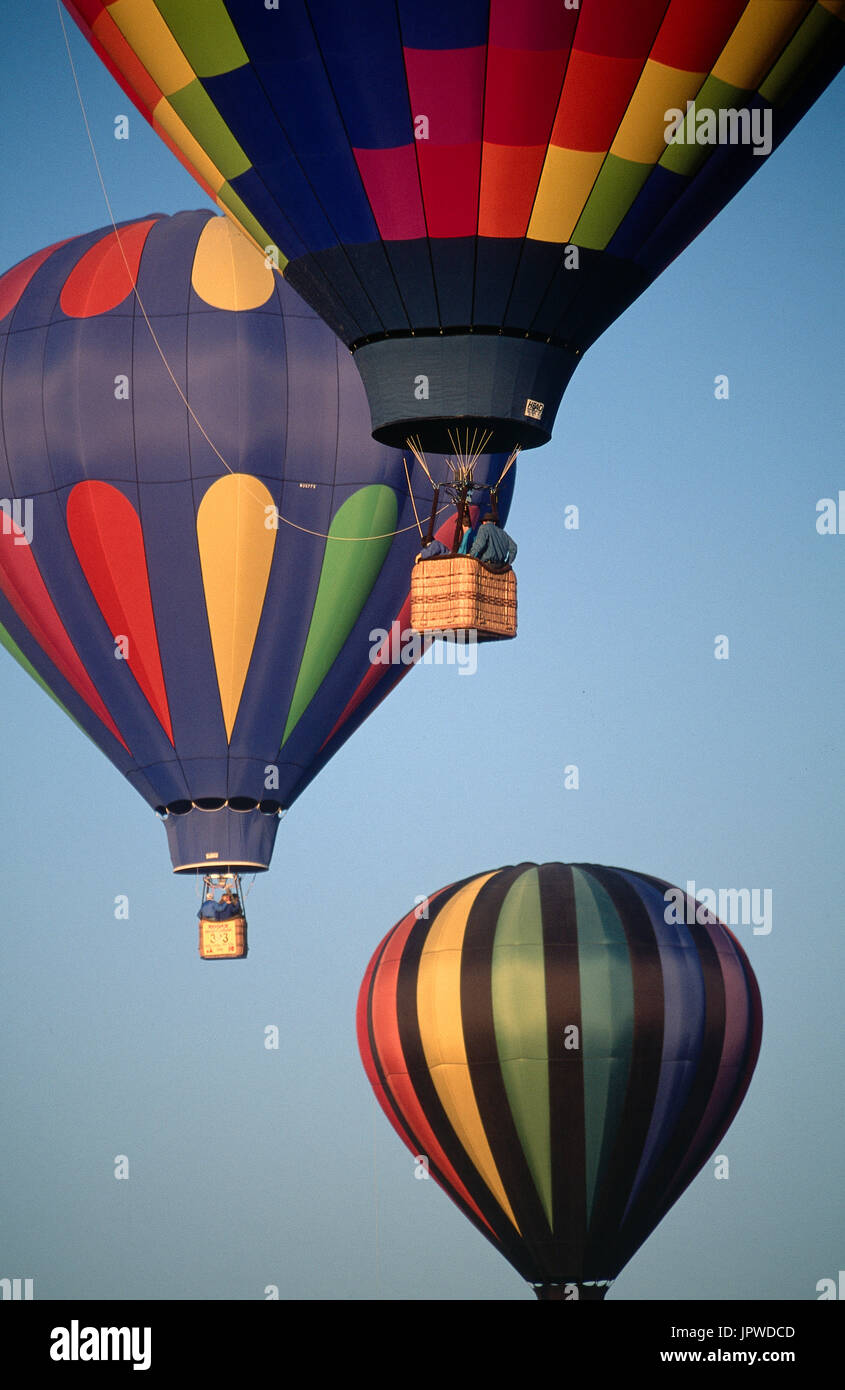 multi-coloured hot-air balloons flying enroute after the mass-ascent at the 1996 Albuquerque International Balloon Fiesta Stock Photo