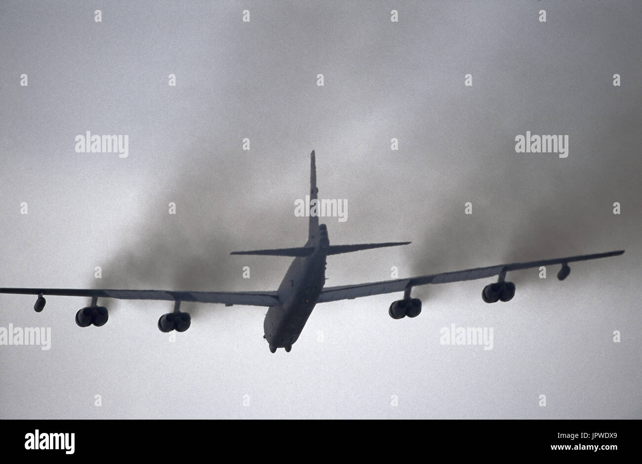 USAF Boeing B-52 Startofortress with black smoke from engines after take-off Stock Photo