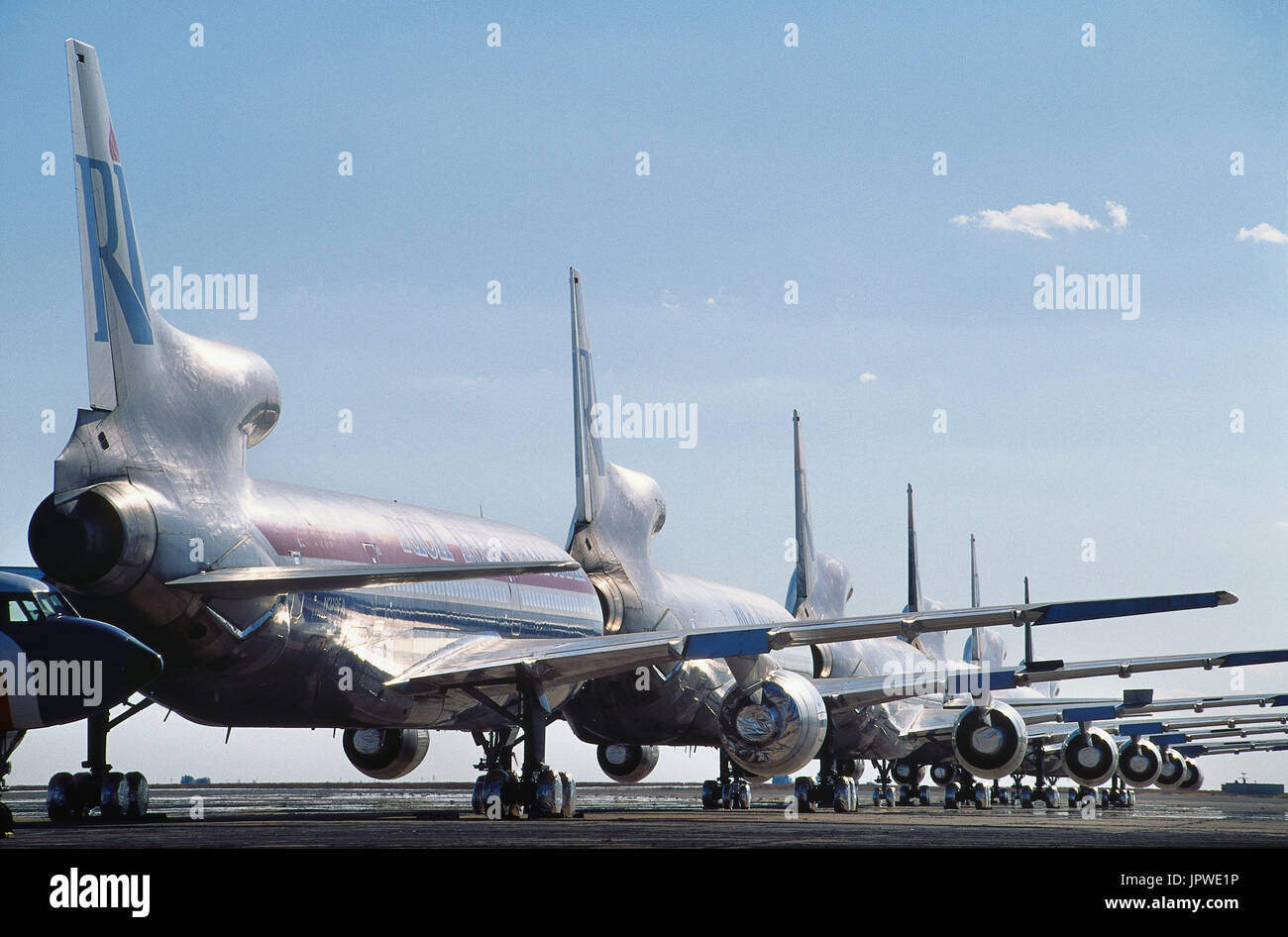 Rich International Lockheed L-1011 Tristars parked in a neat line in desert-storage Stock Photo