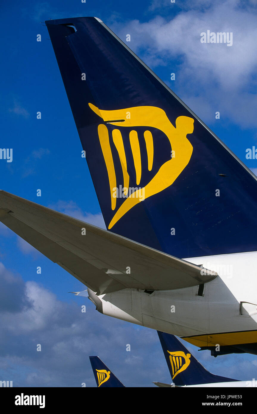 tail-fins with logos of Ryanair Boeing 737s parked at the terminal Stock Photo