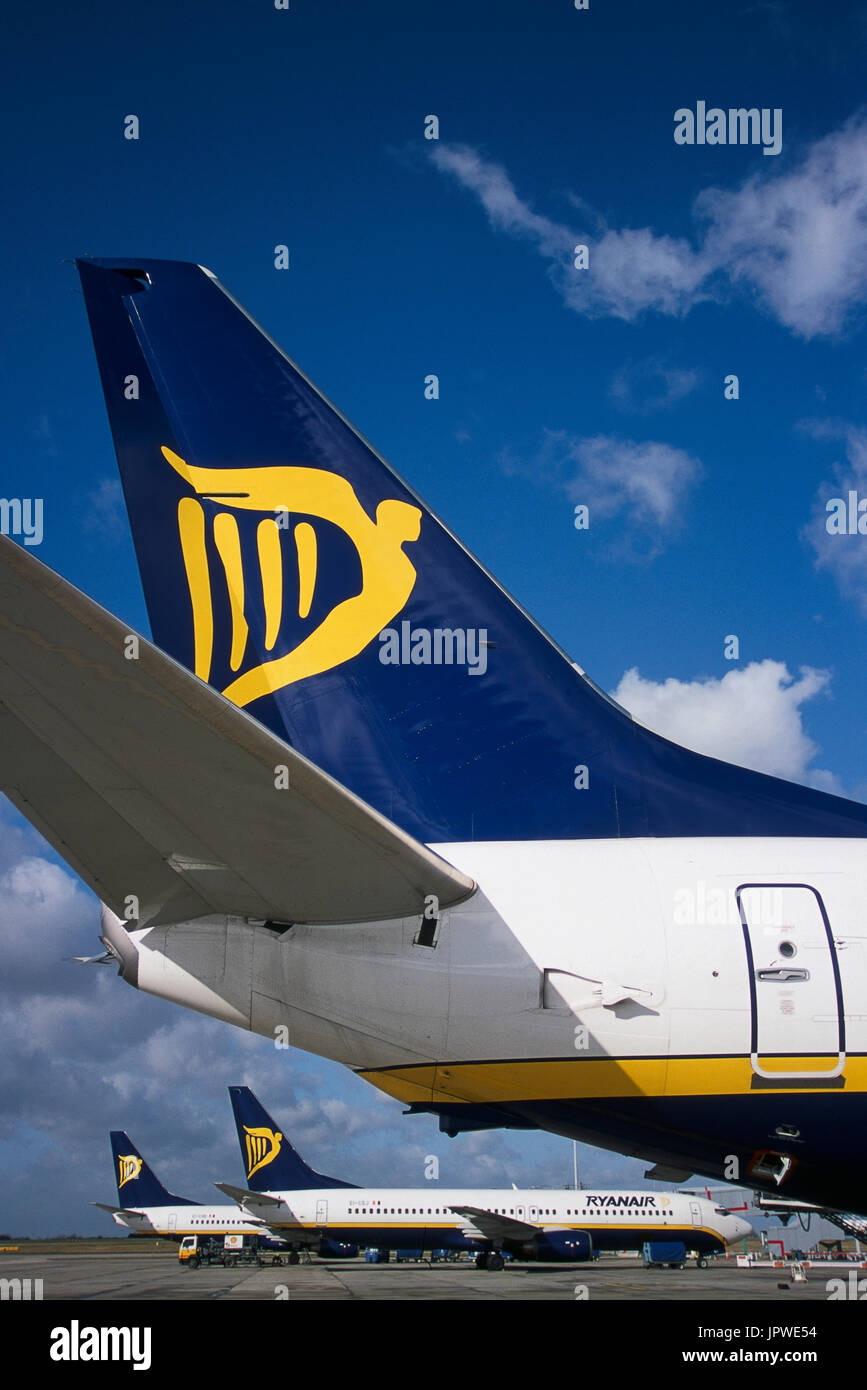 tail-fins with logos of Ryanair Boeing 737s parked at the terminal Stock Photo