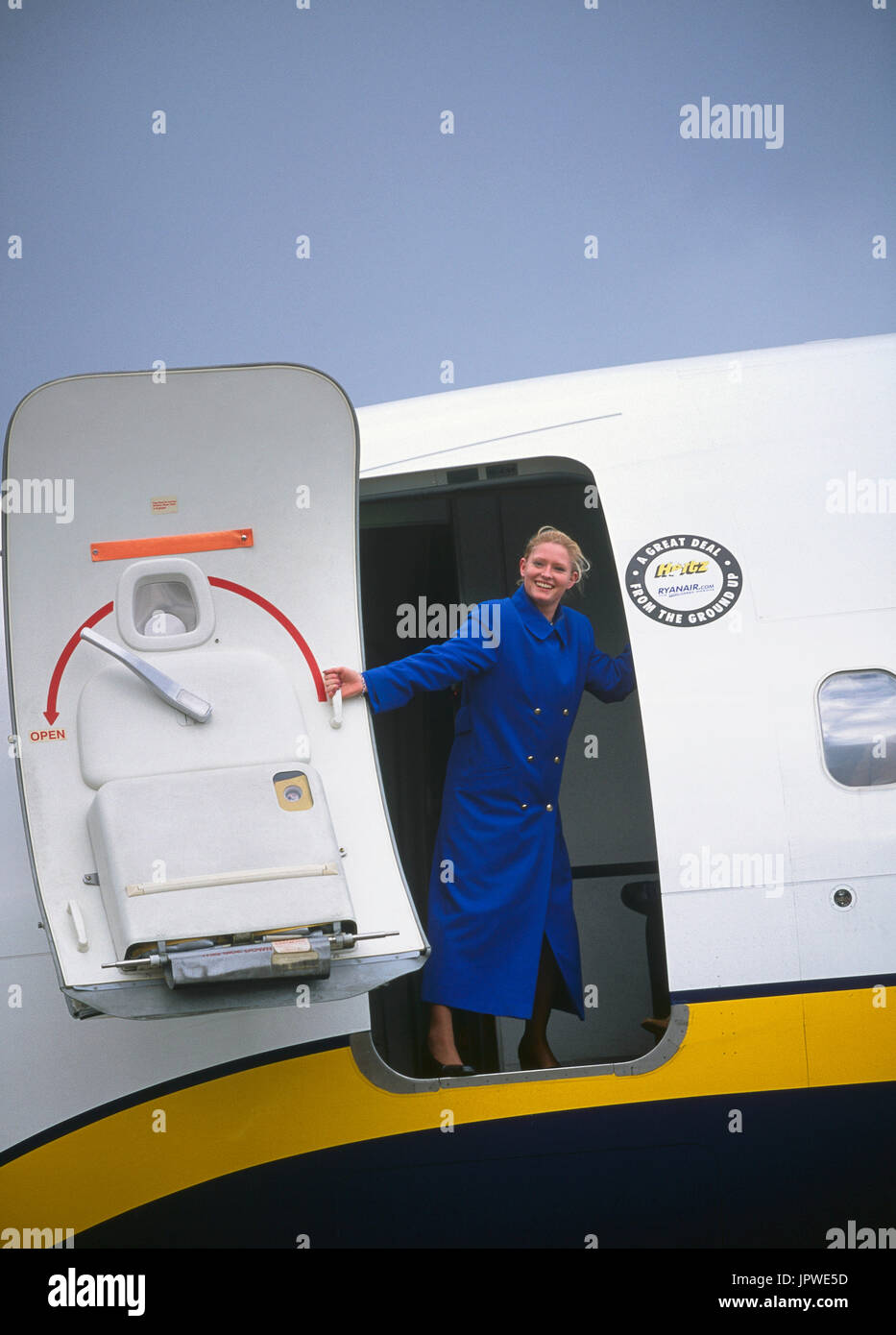 Stewardess Wearing Blue Winter Overcoat Closing Front Door Of A Stock ...