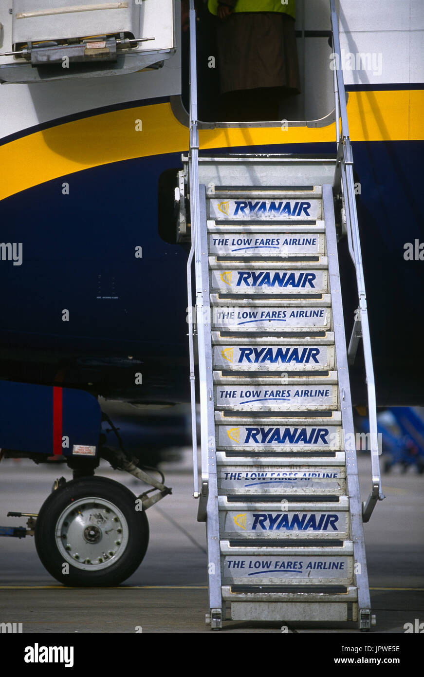 Ryanair branded airstairs leading to the open door and nose wheel undercarriage below of a Ryanair Boeing 737-800 Stock Photo