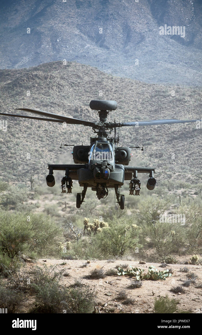 US Army Boeing AH-64D Apache Longbow low-flying over the Four Peaks desert area of Tonto National Forest, flown by test pilot - Pete Nicholson Stock Photo
