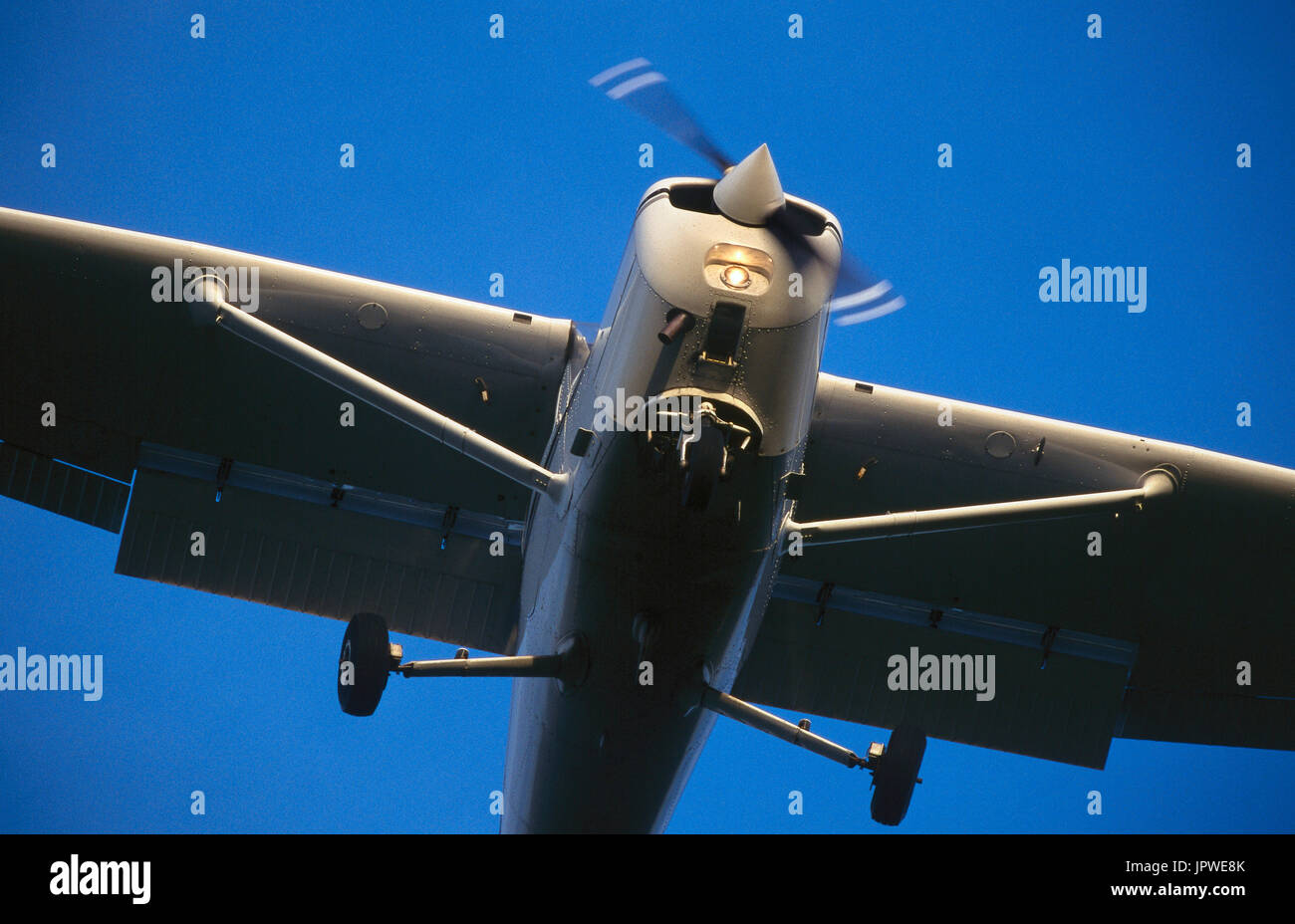 Cessna 152 on final-approach with flaps deployed Stock Photo