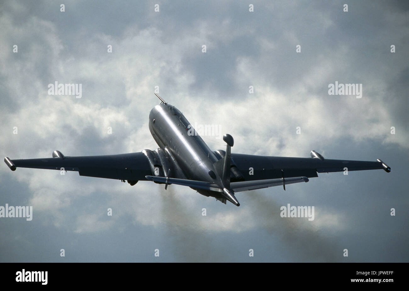 Royal Air Force RAF BAE Nimrod MR-2 with black jet-exhaust in the flying-display at the 1998 Farnborough Air Show with clouds Stock Photo