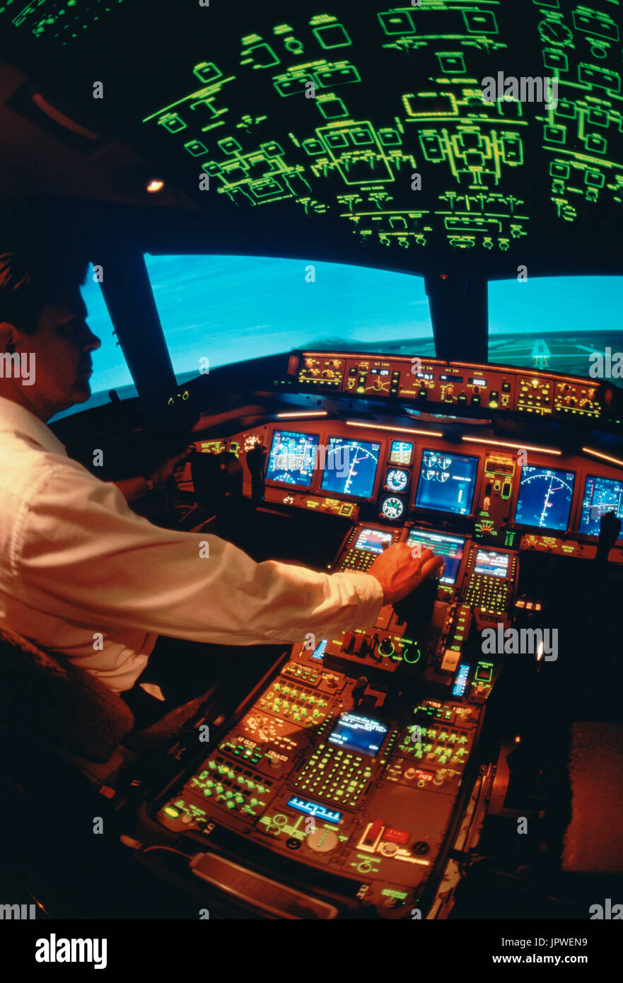 Pilot In A Boeing 777 0 Airliner Cockpit Simulator Stock Photo Alamy