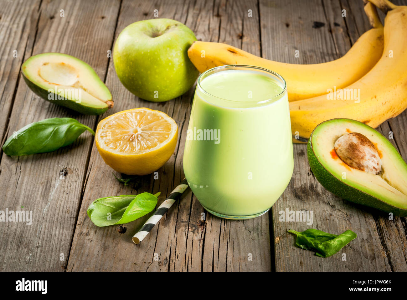 Healthy food. Dietary breakfast or snack. Green smoothies from yoghurt,  avocado, banana, apple, spinach and lemon. On a rustic wooden table, with  ingr Stock Photo - Alamy