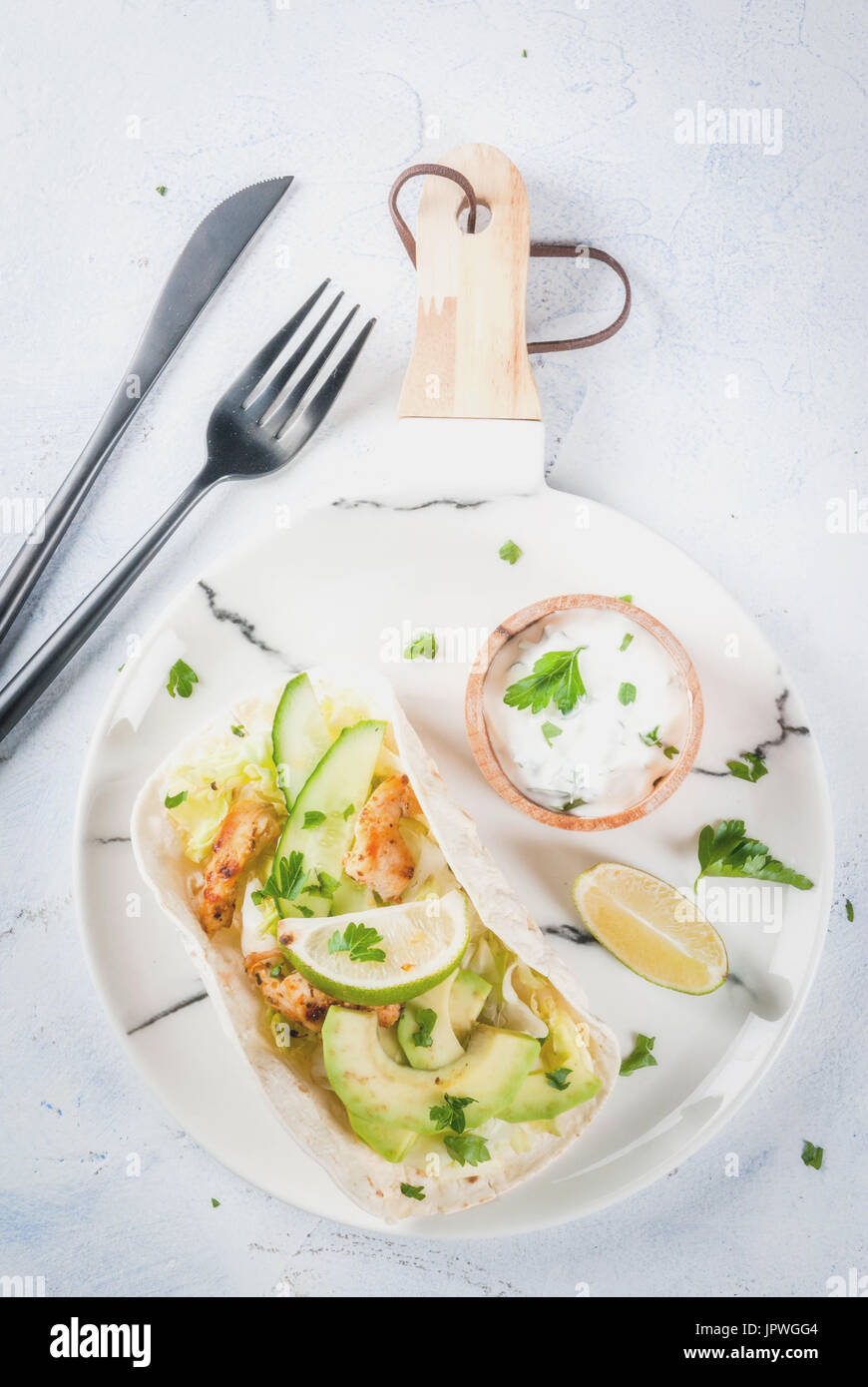 Healthy food snack. Tortillas taco with grilled chicken, avocado, fresh