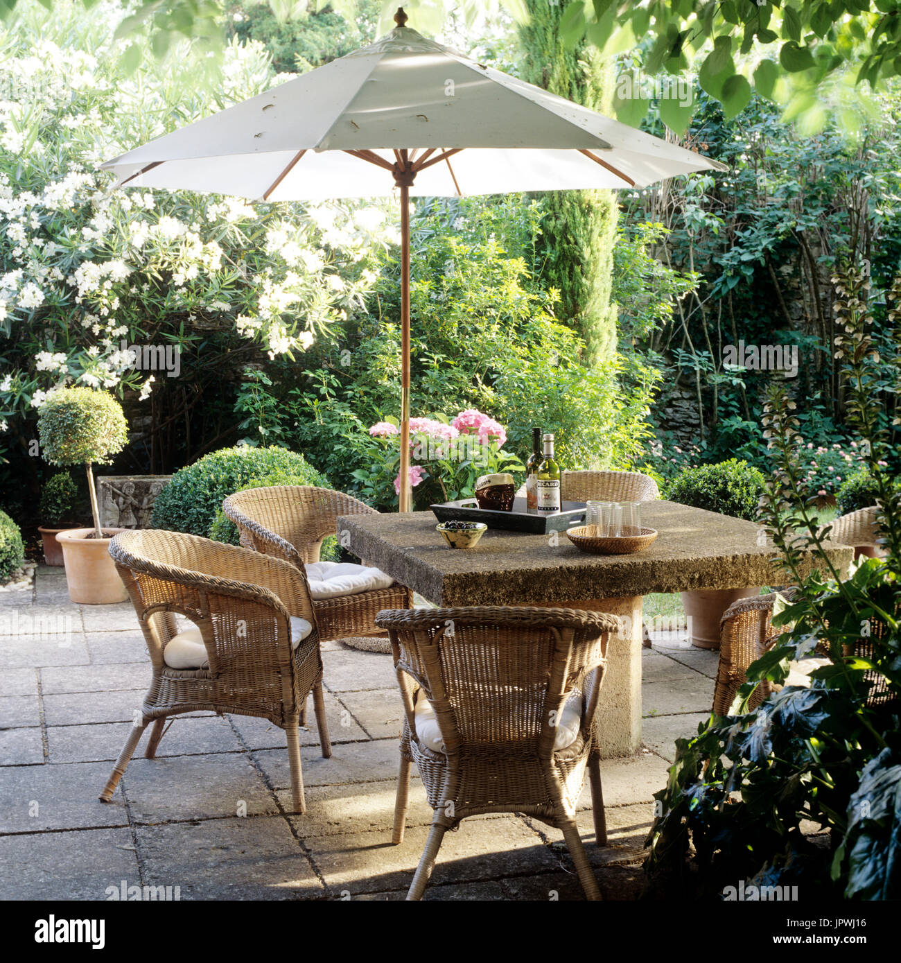 Garden table and chairs umbrella hi-res stock photography and images - Alamy
