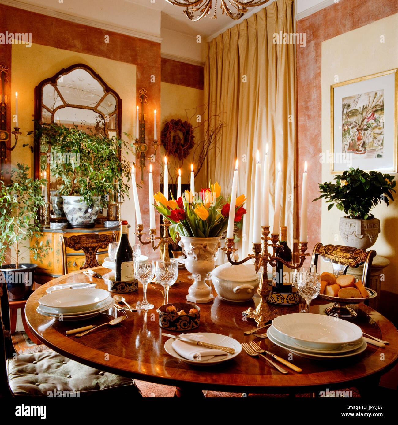 Dining room with lit candles Stock Photo Alamy