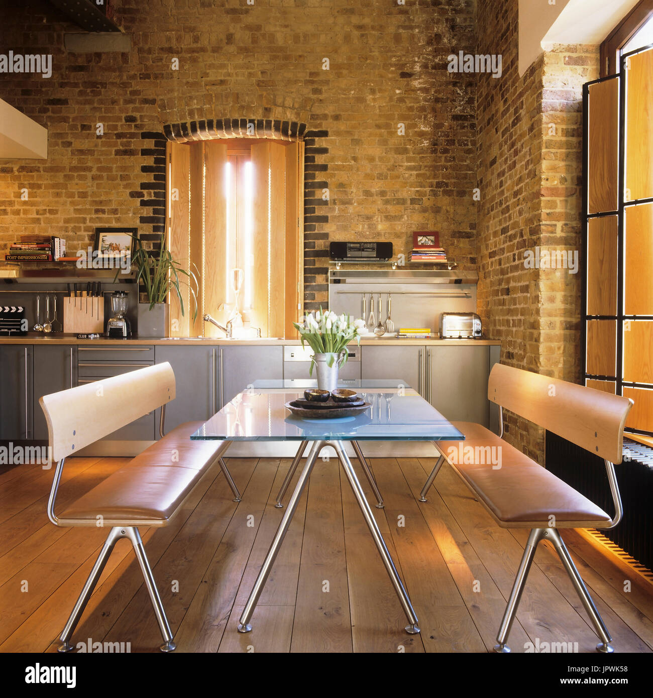 Modern style kitchen and dining table Stock Photo Alamy