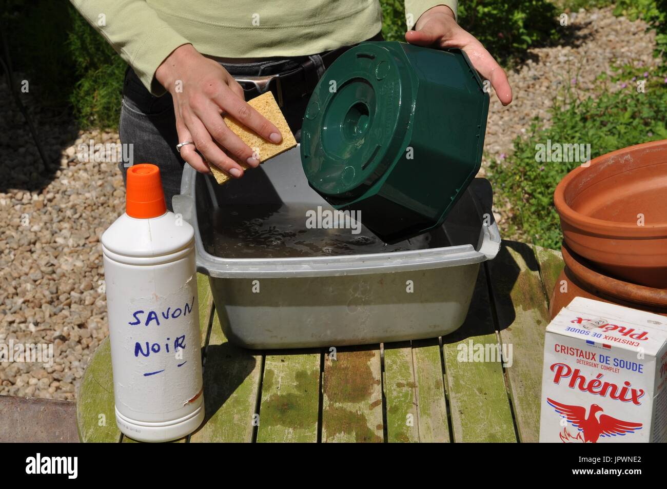 Cleaning of pots in a garden Stock Photo Alamy