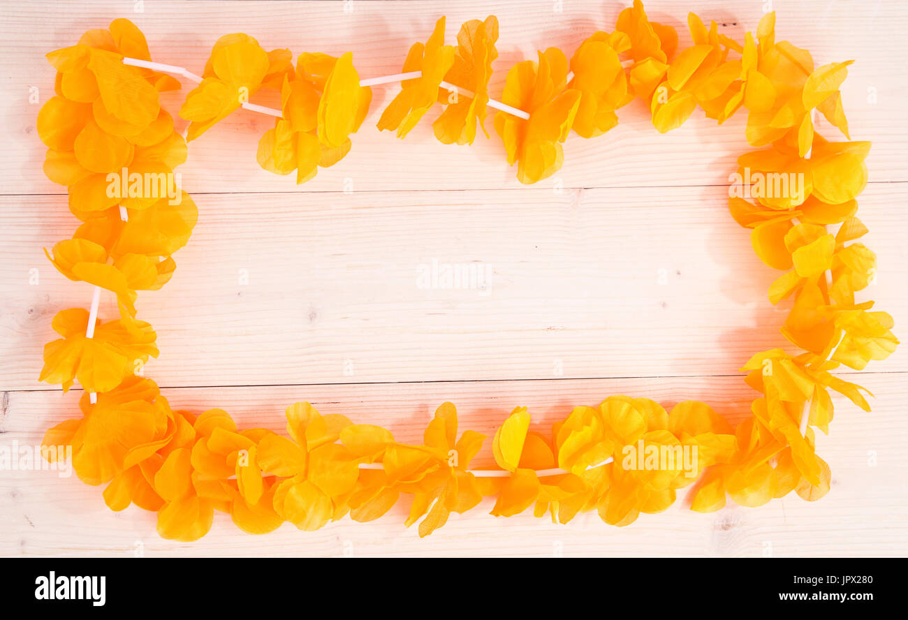 Dutch orange flower necklace on wooden background Stock Photo