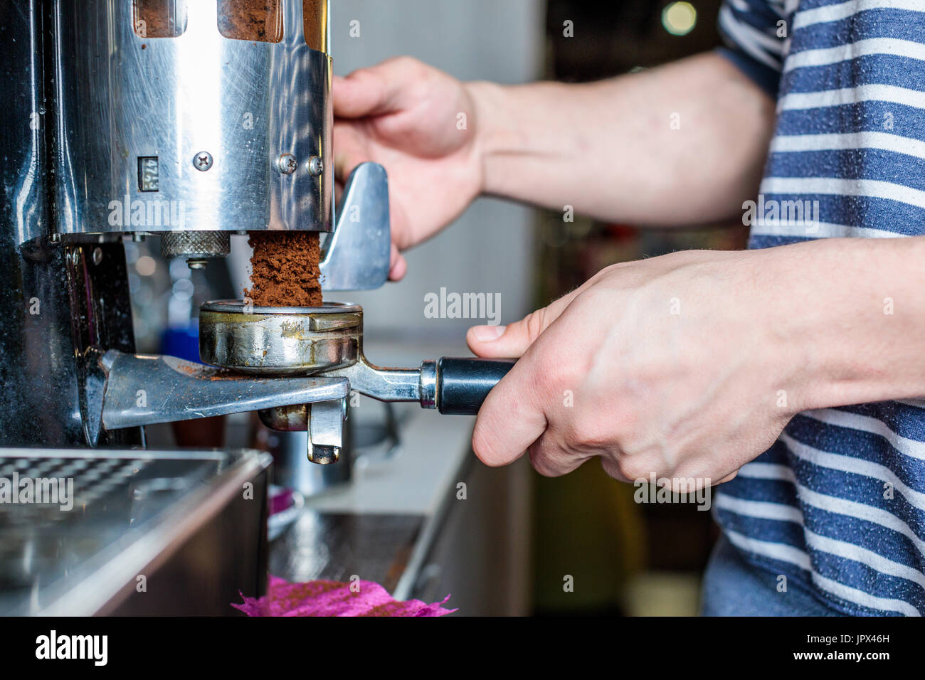 side view of barista cleaning coffee machine in cafe Stock Photo Alamy