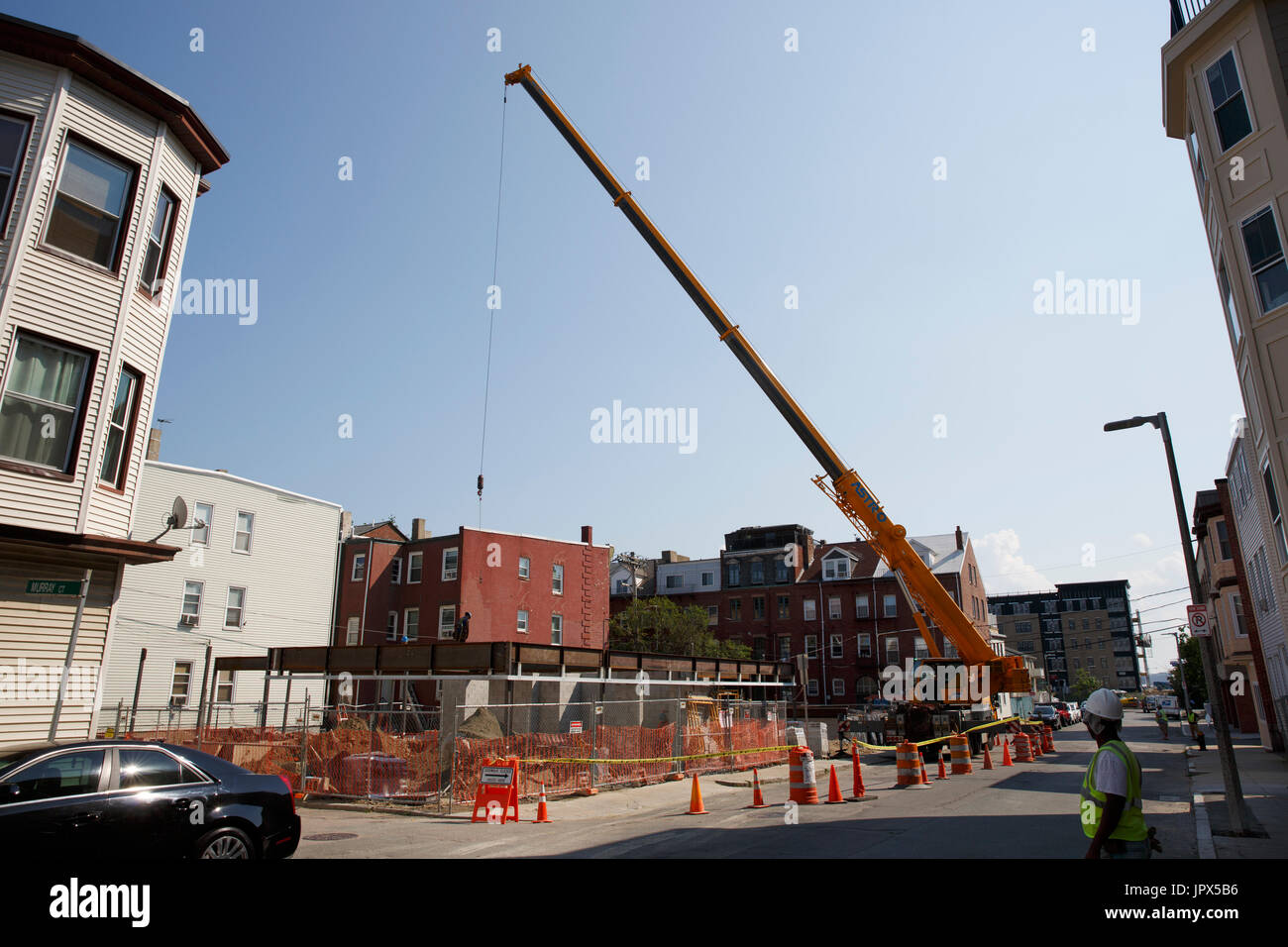 Construction crane in residential neighborhood East Boston Massachusetts Stock Photo