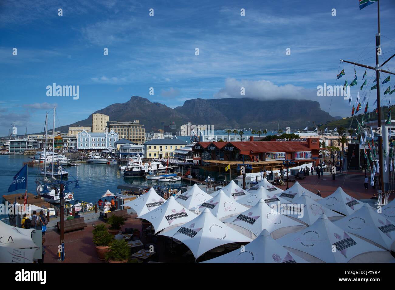 Historic buildings and restaurants in the Victoria and Albert Waterfront in Cape Town in South Africa. Table Mountain in the background. Stock Photo