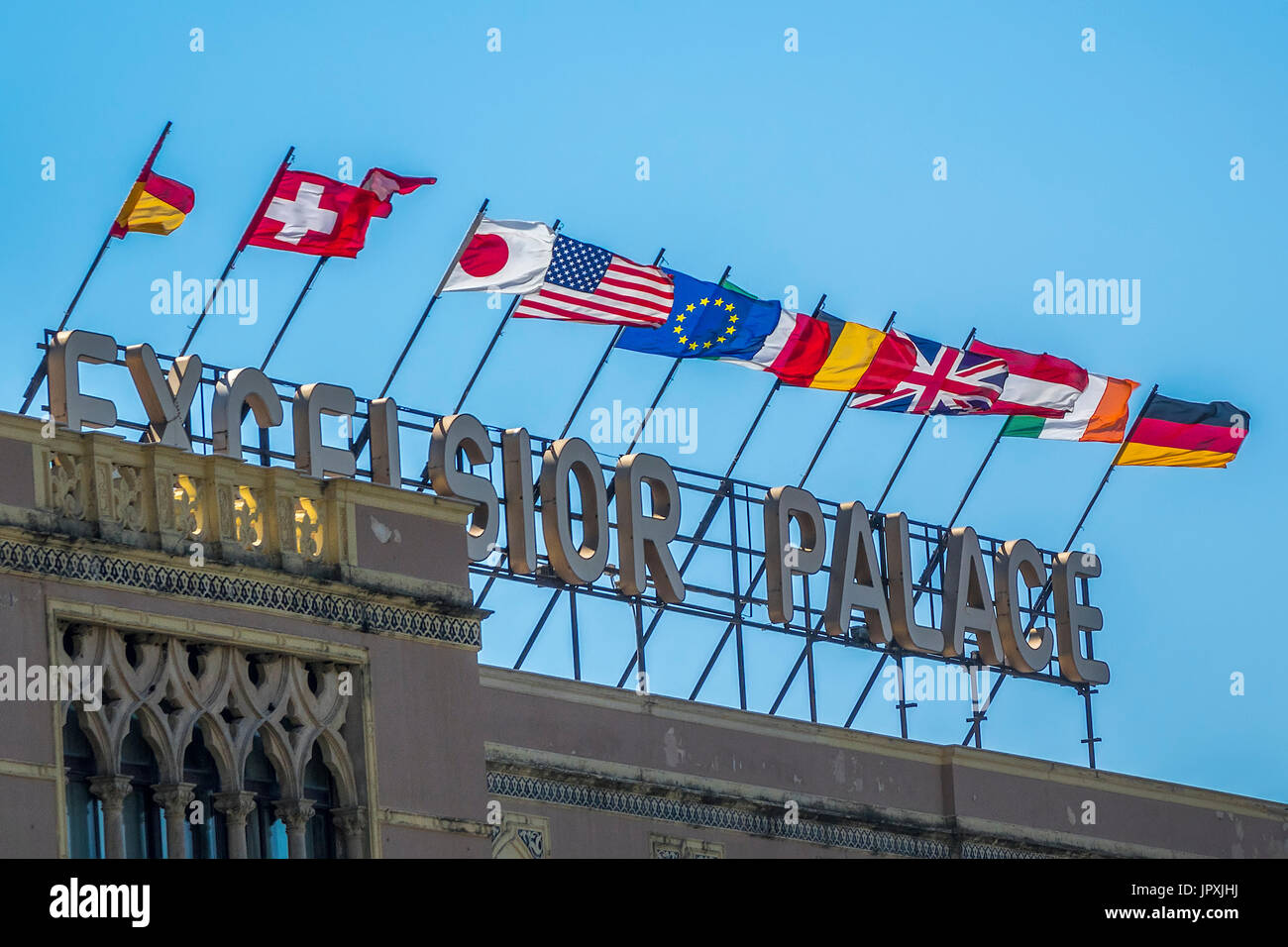 Flags Flying From The Excelsior Hotel Taormina Italy Stock - 