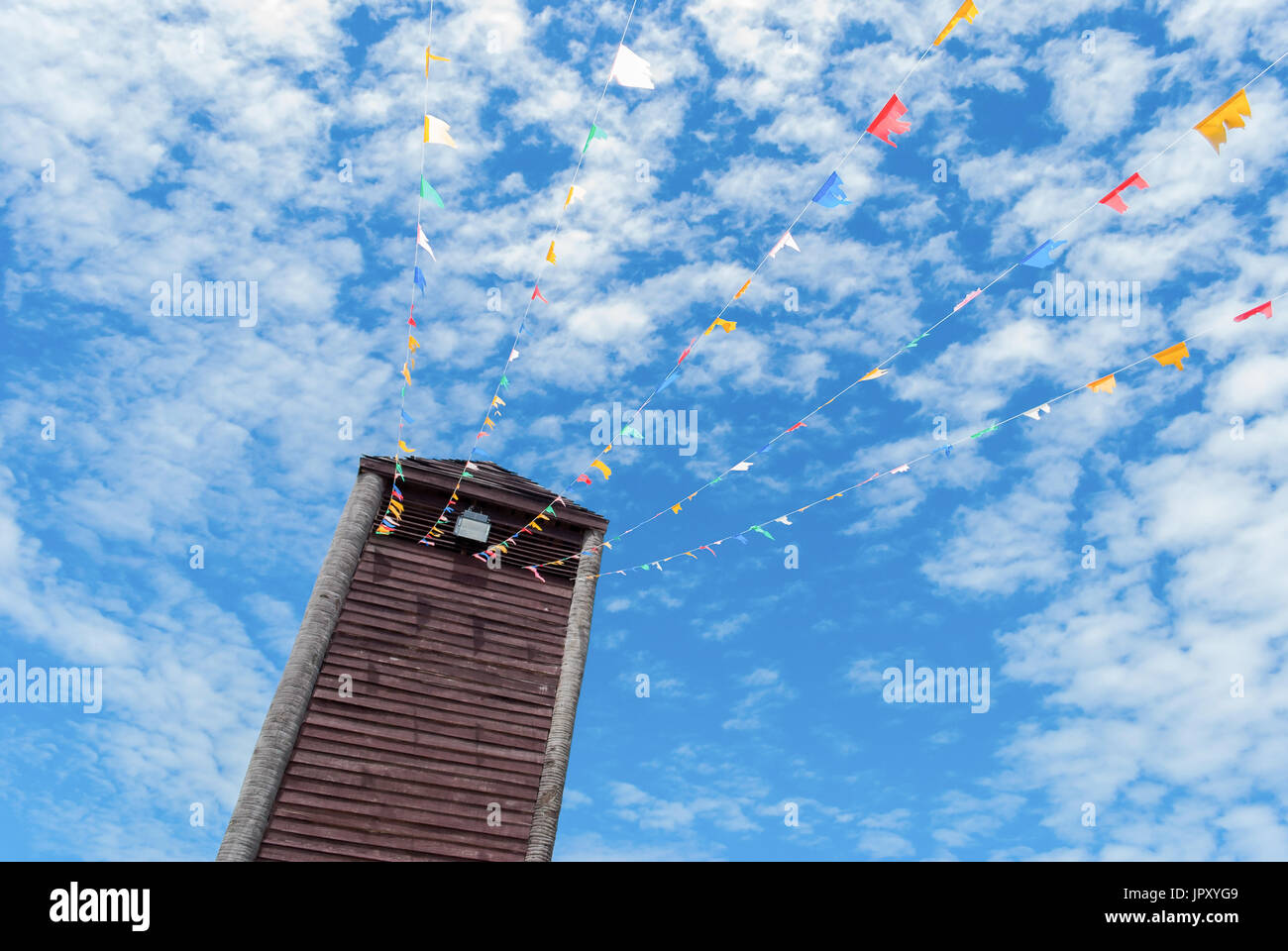 Old vintage wooden tower with blue sky background Stock Photo - Alamy