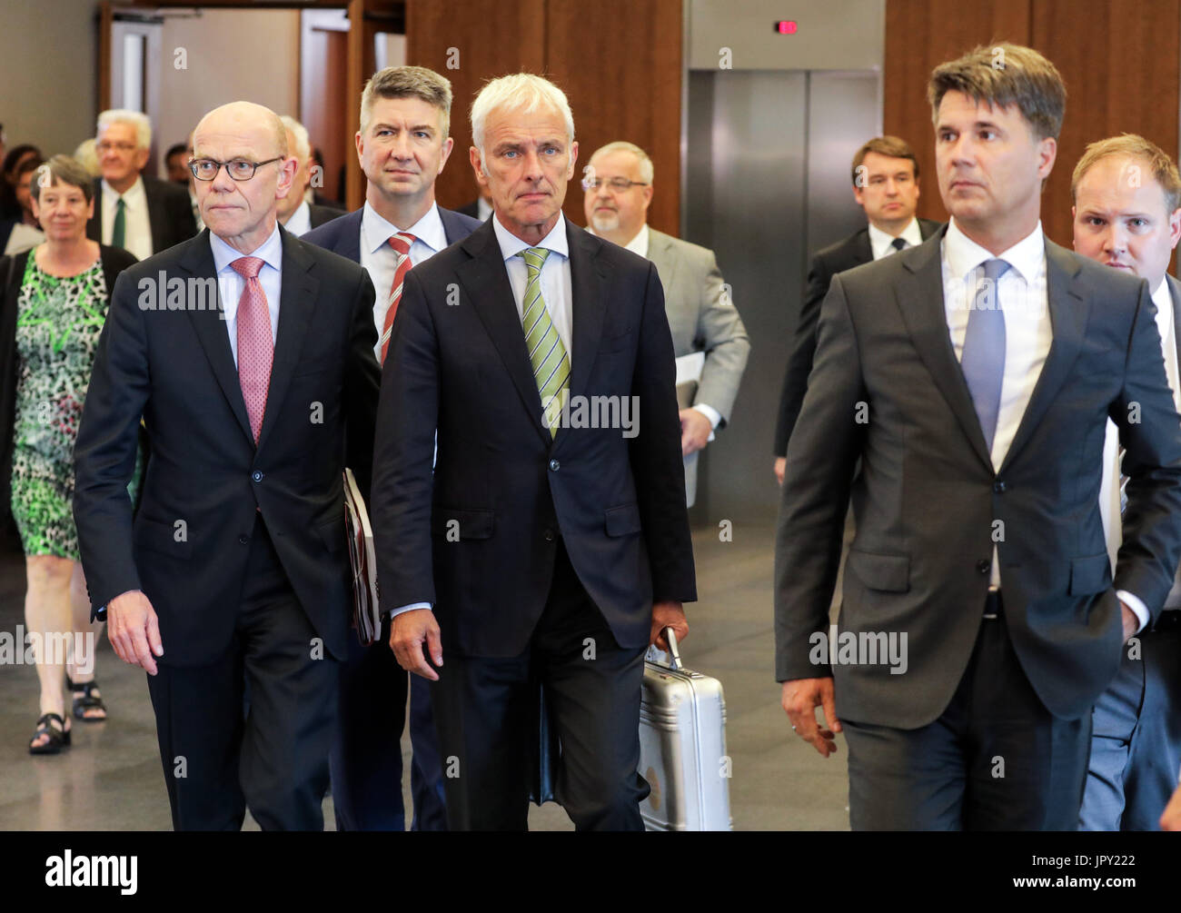 Berlin, Germany. 2nd Aug, 2017. dpatop - (L-R) Volkswagen's chief lobbyist Thomas Steg, chairman of the board of Volkswagen Matthias Mueller and chairman of the board at BMW Harald Krueger leave the Federal Ministry of the Interior after a summit on diesel and the reduction of harmful emmissions in Berlin, Germany on 2 August, 2017. The diesel summit was relocated from the Federal Ministry of Transport to the Federal Ministry of the Interior. Credit: dpa picture alliance/Alamy Live News Stock Photo