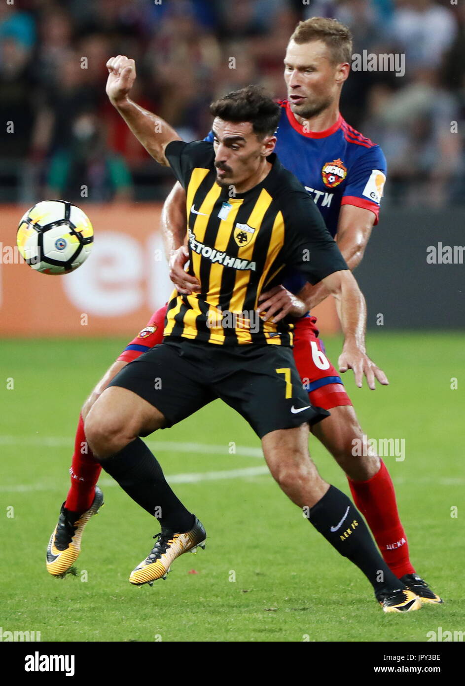 Moscow, Russia. 2nd Aug, 2017. AEK Athens' Lazaros Christodoulopoulos (L)  and CSKA Moscow's Alexei Berezutsky fight for the ball in the second leg of  their 2017/18 UEFA Champions League third qualifying round