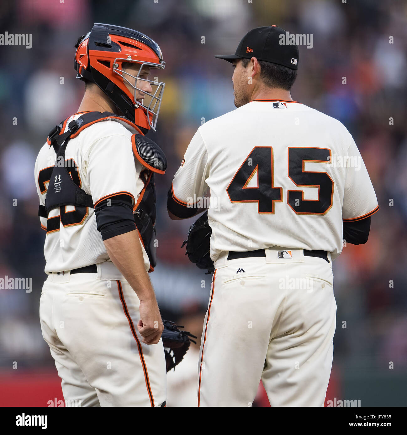 San Francisco, California, USA. 2nd August, 2017. San Francisco Giants catcher Buster Posey (28) goes to the mound to have a word with starting pitcher Matt Moore (45) in the second inning, during a MLB game between the Oakland Athletics and the San Francisco Giants at AT&T Park in San Francisco, California. Valerie Shoaps/CSM/Alamy Live News Stock Photo
