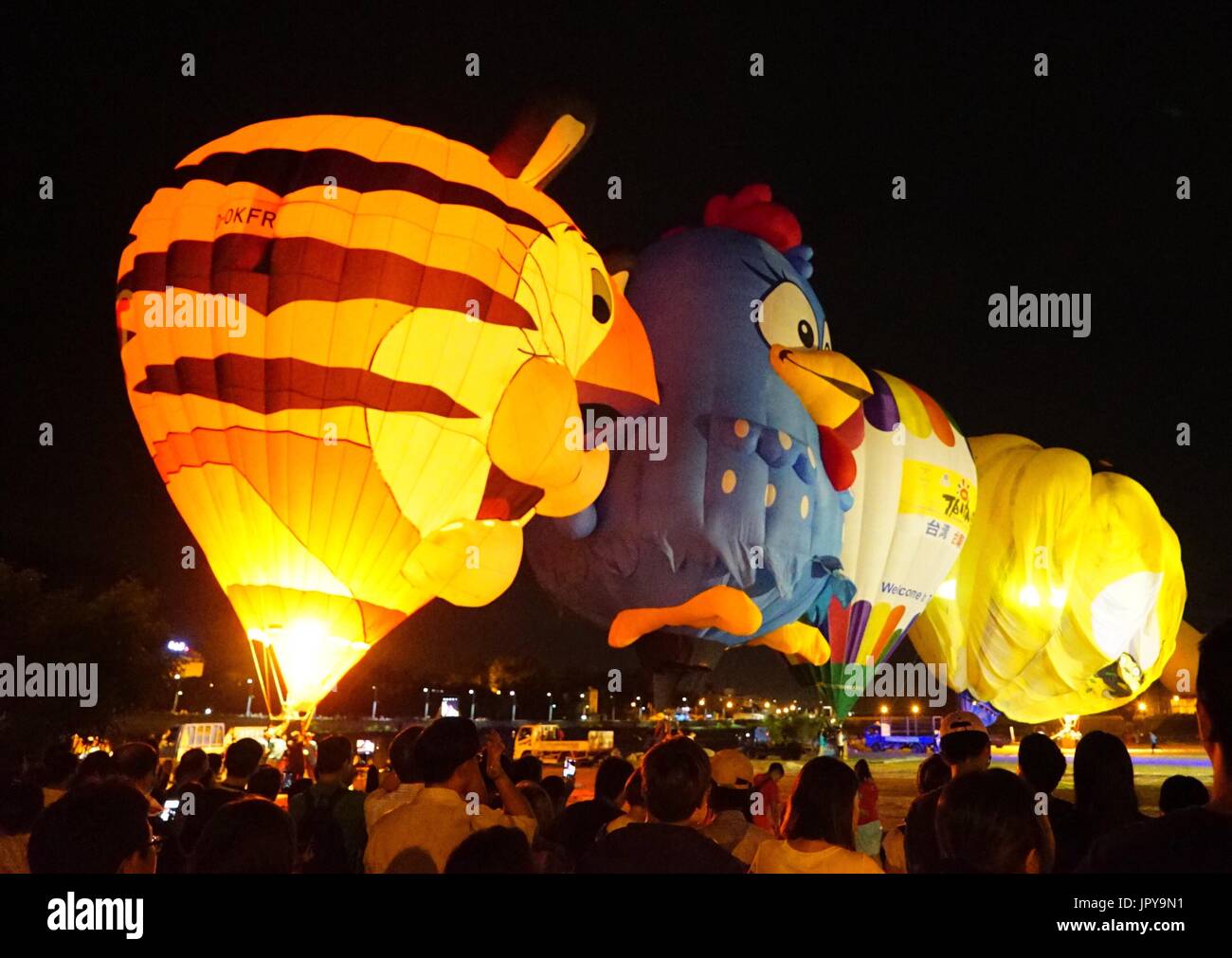 Hot air balloons of various shapes are seen during a Balloon