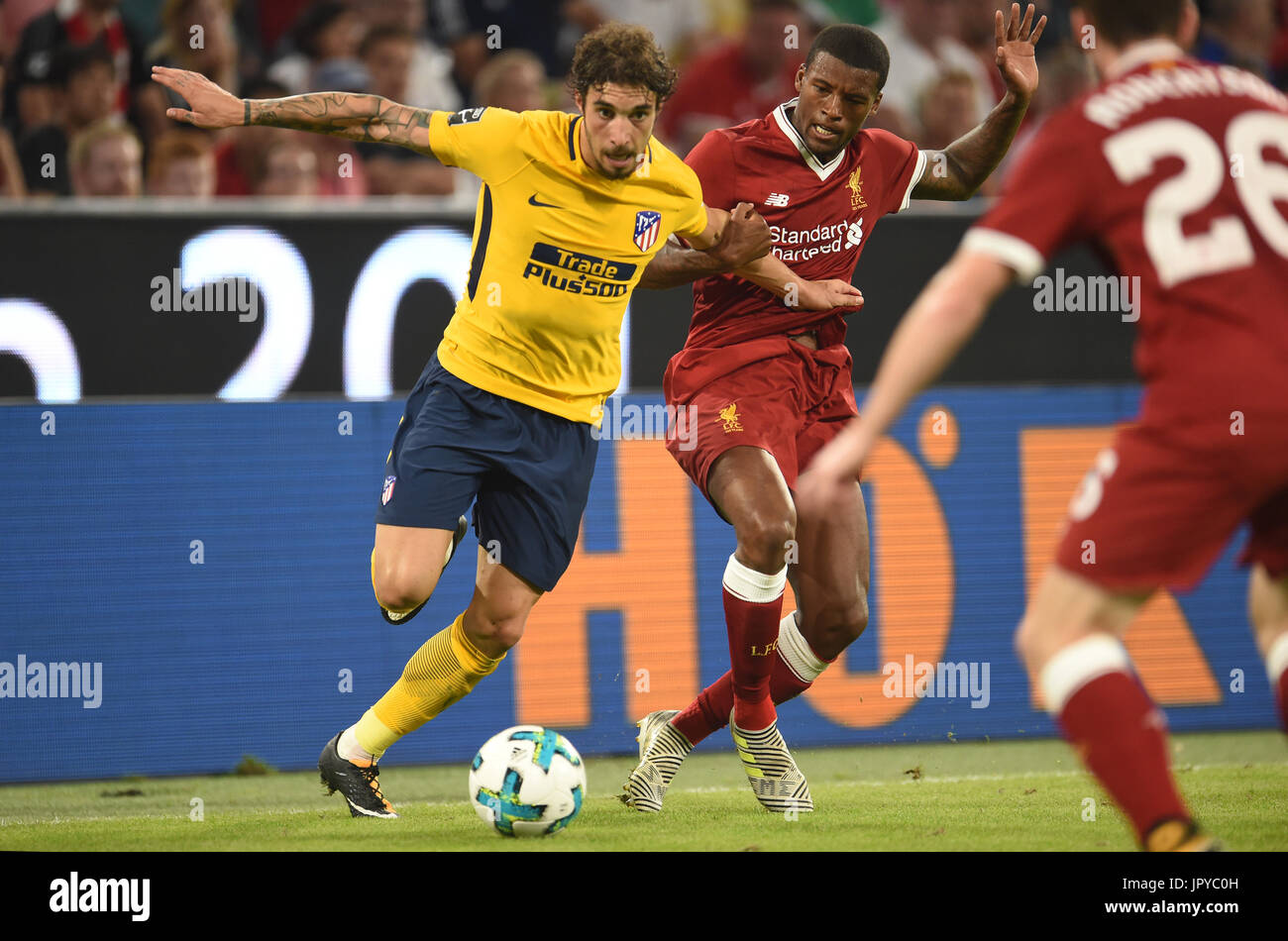 Munich, Germany. 2nd Aug, 2017. Liverpool's Joel Matip (C) and Madrid's Vrsaljko vie for the ball during the Audi Cup final soccer match between Atletico Madrid and FC Liverpool in the Allianz Arena in Munich, Germany, 2 August 2017. Photo: Andreas Gebert/dpa/Alamy Live News Stock Photo