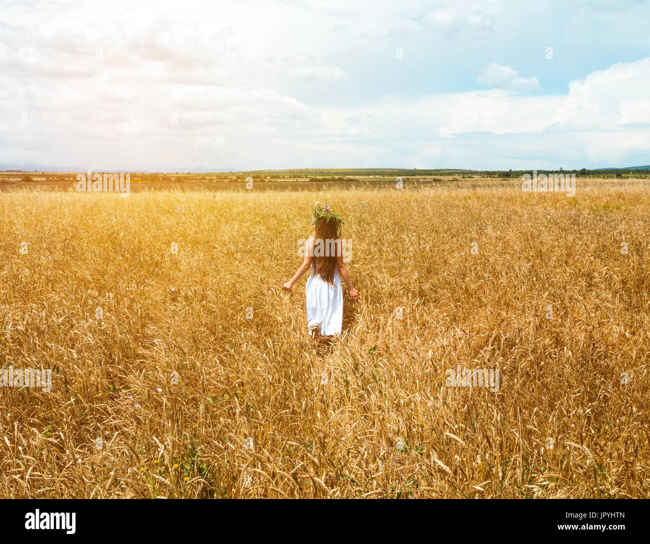 little girl in the wheat field Stock Photo - Alamy