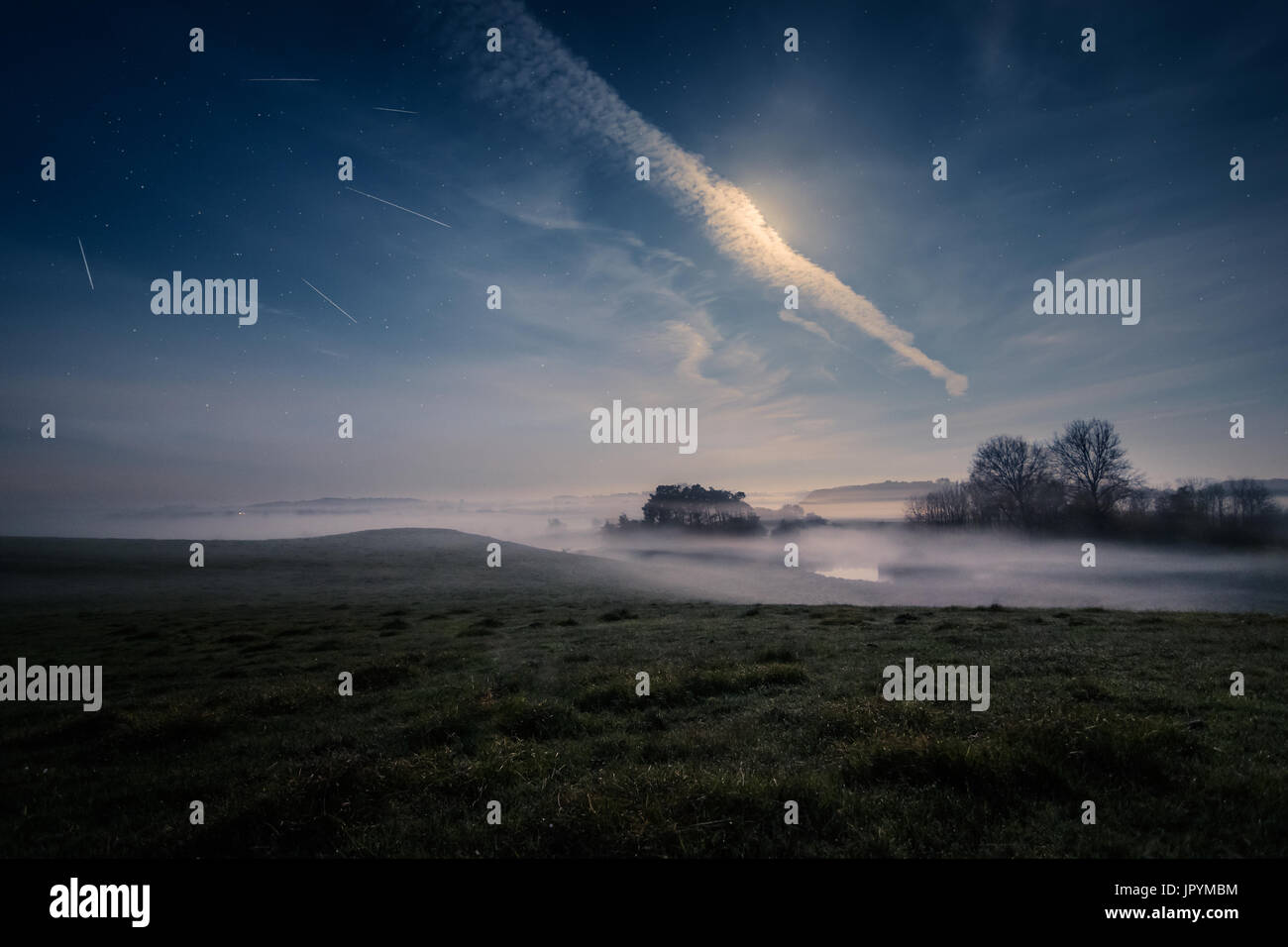 Meteor shower over tranquil landscape, Naestved, Denmark Stock Photo
