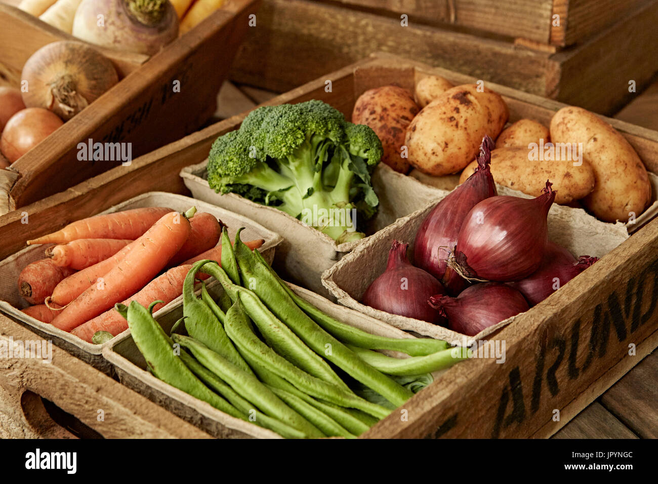 Still life fresh, organic, healthy vegetable harvest variety in wood crate Stock Photo