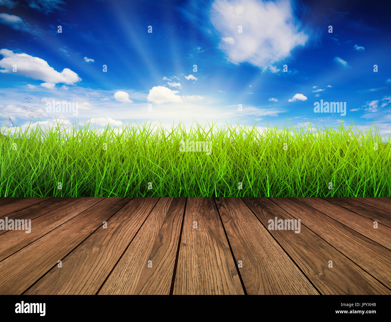 wooden floor with green grass and blue sky background Stock Photo - Alamy
