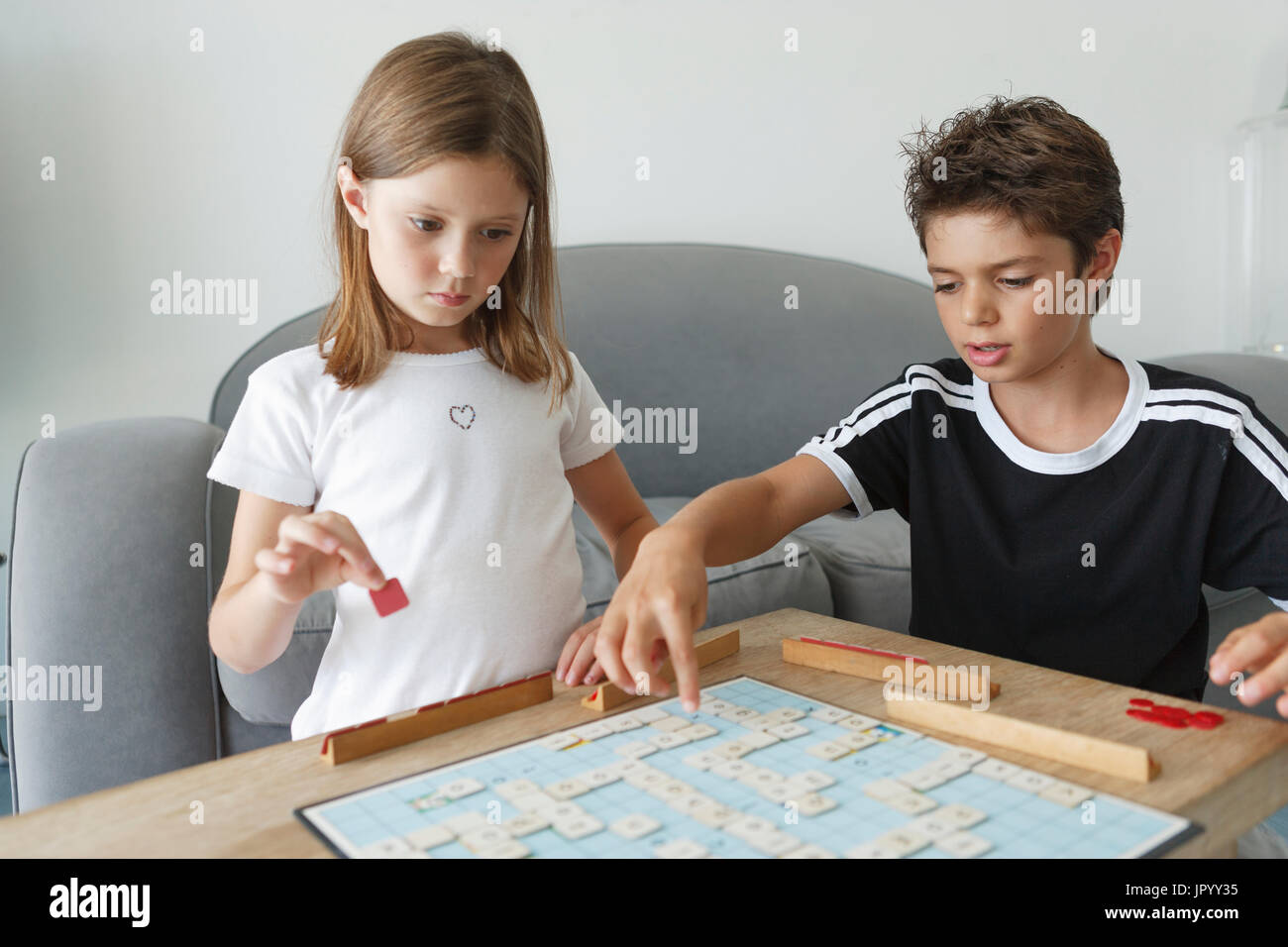 Two boys play board game hi-res stock photography and images - Alamy