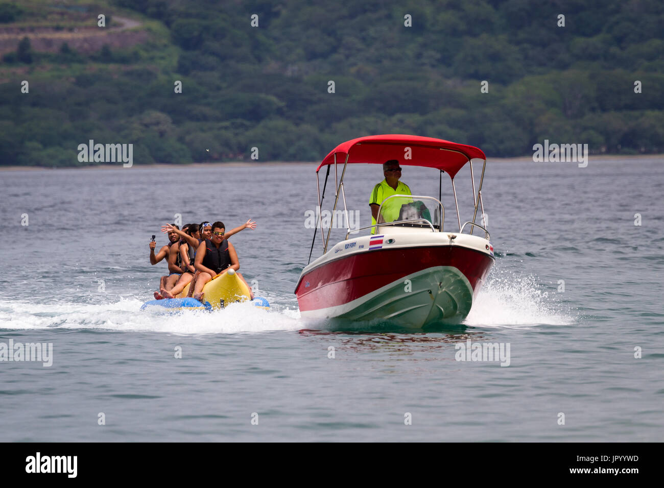 Guanacaste, Costa Rica- July 25: Family enjoying a banana boat ride in ...