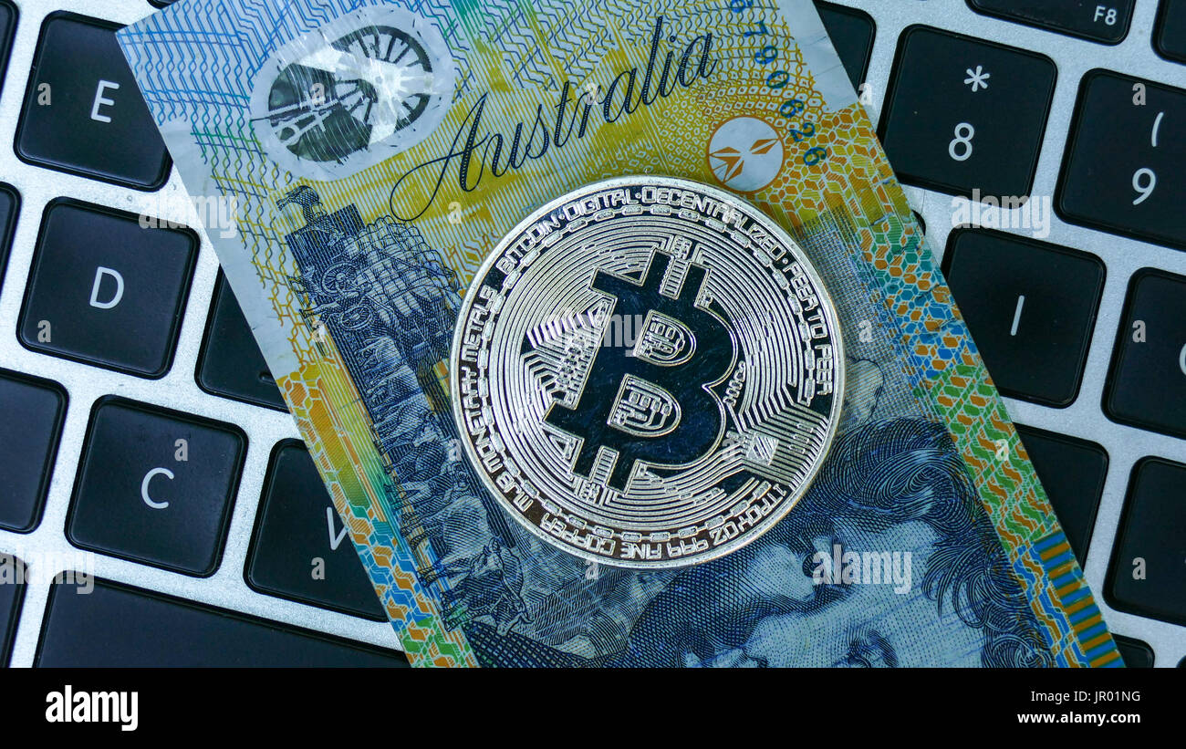 Bitcoin on Australian Dollar banknote. Electronic money exchange