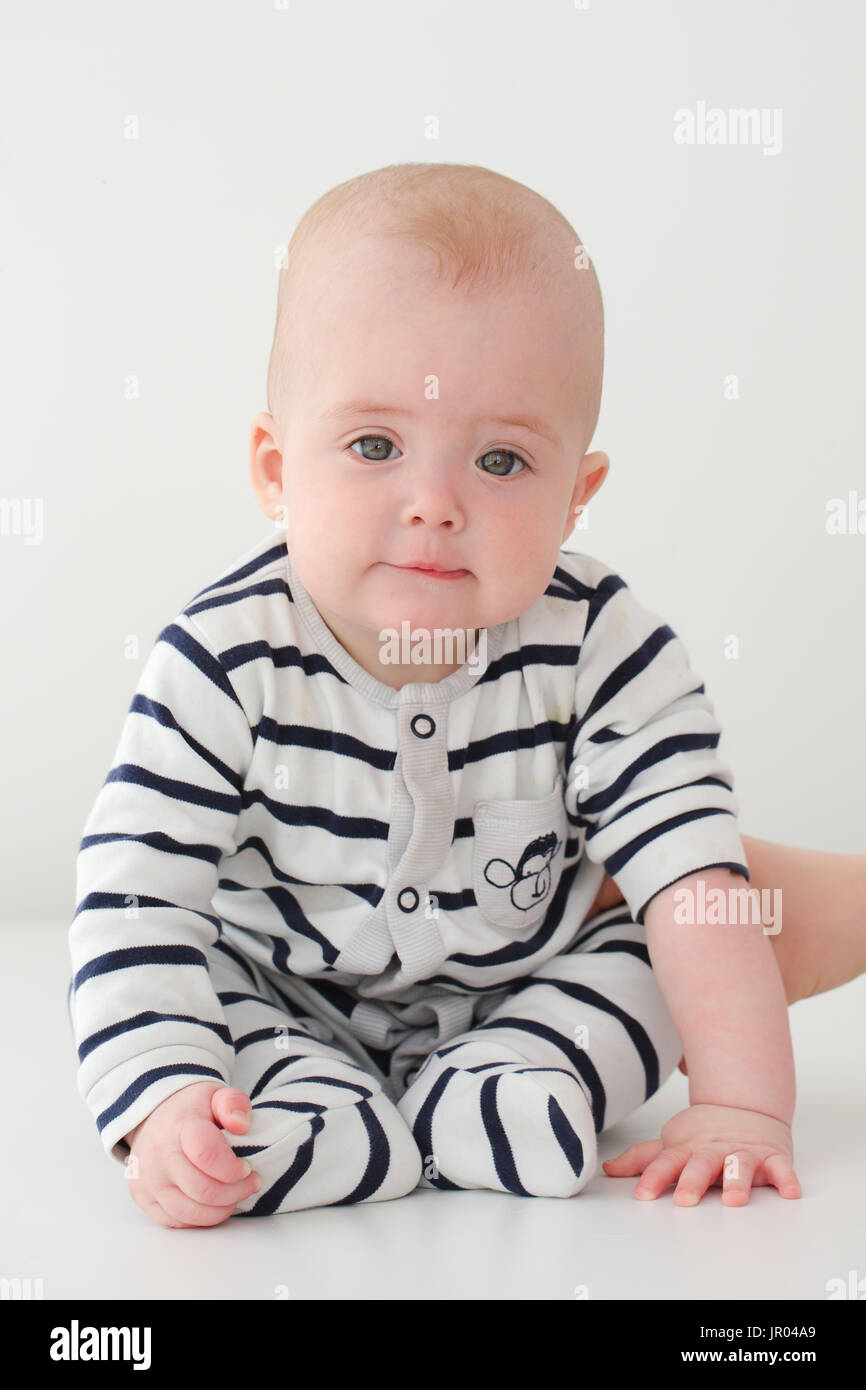 Portrait of upset kid on a white background Stock Photo