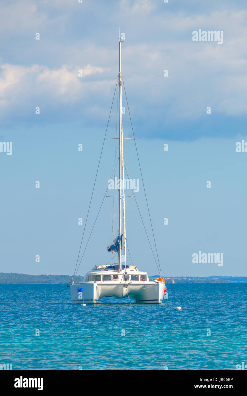 Luxury sailing catamaran in open sea Stock Photo