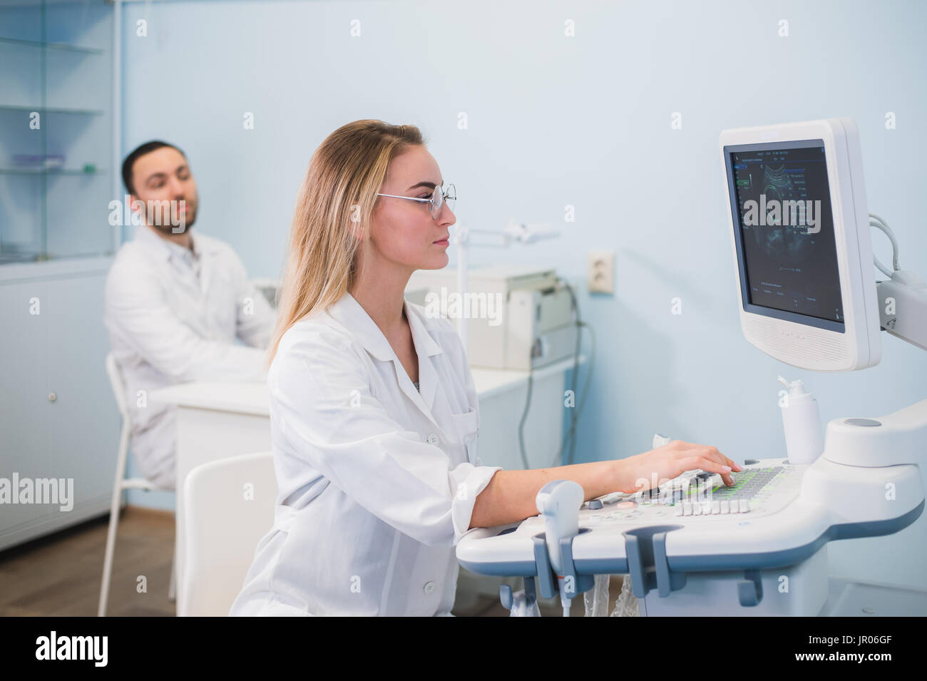 Cheerful young researchers are working in lab Stock Photo
