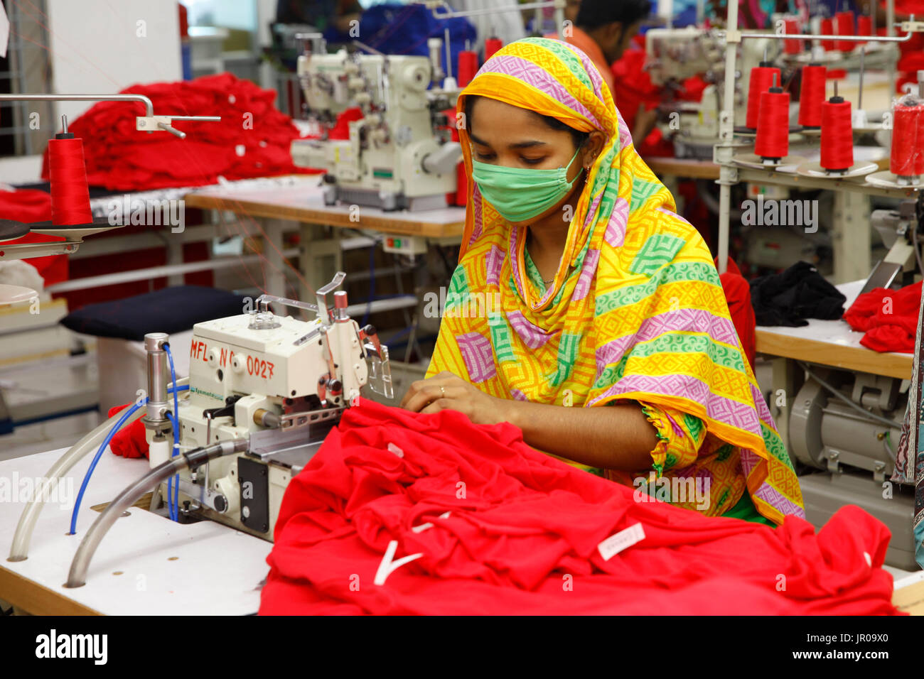 Readymade garment workers participate in a fire fighting training session for their safety in a