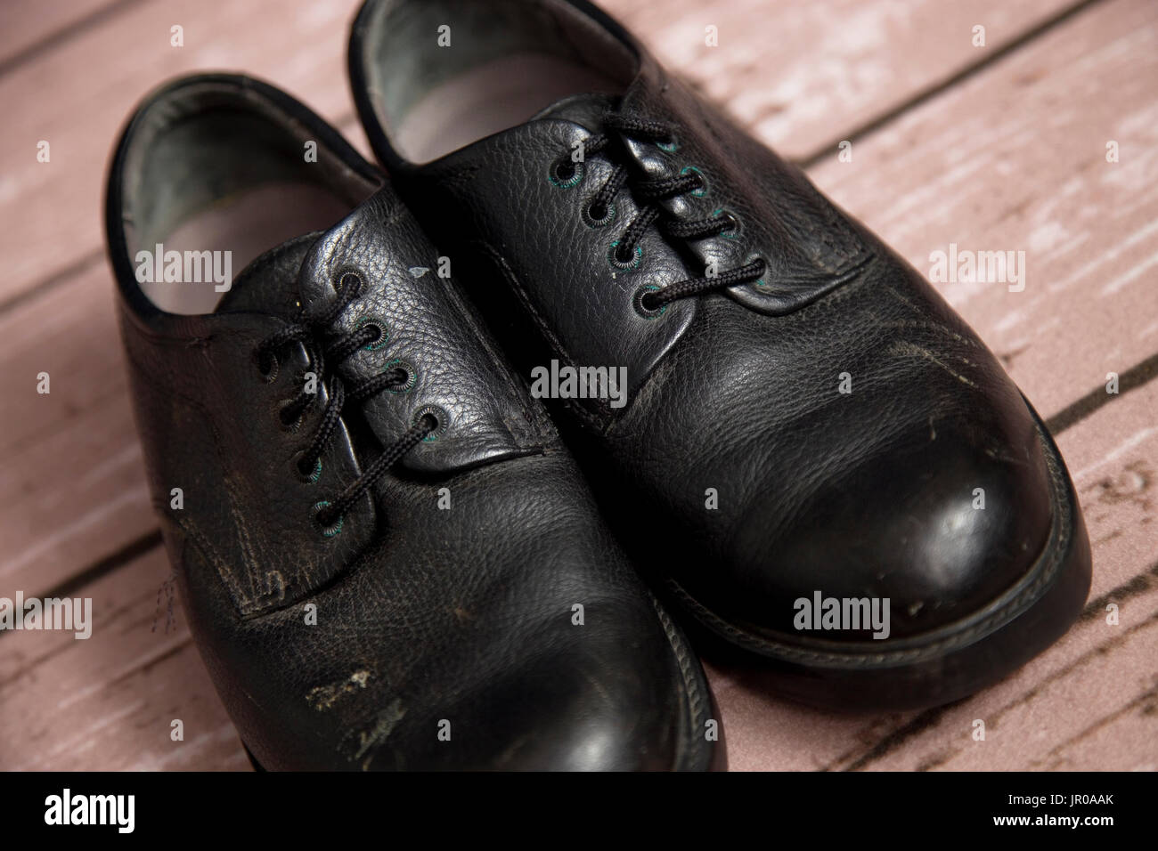 Old Black Dress Shoes on a Wooden Floor Stock Photo - Alamy