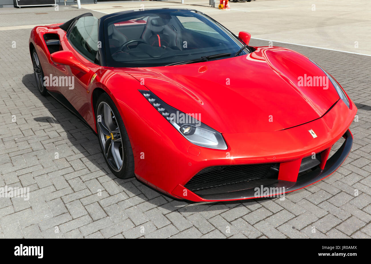A Three-quarter view of a Ferrari 488 Spider, on static display in the international paddock, at the 2017 Silverstone Classic Stock Photo