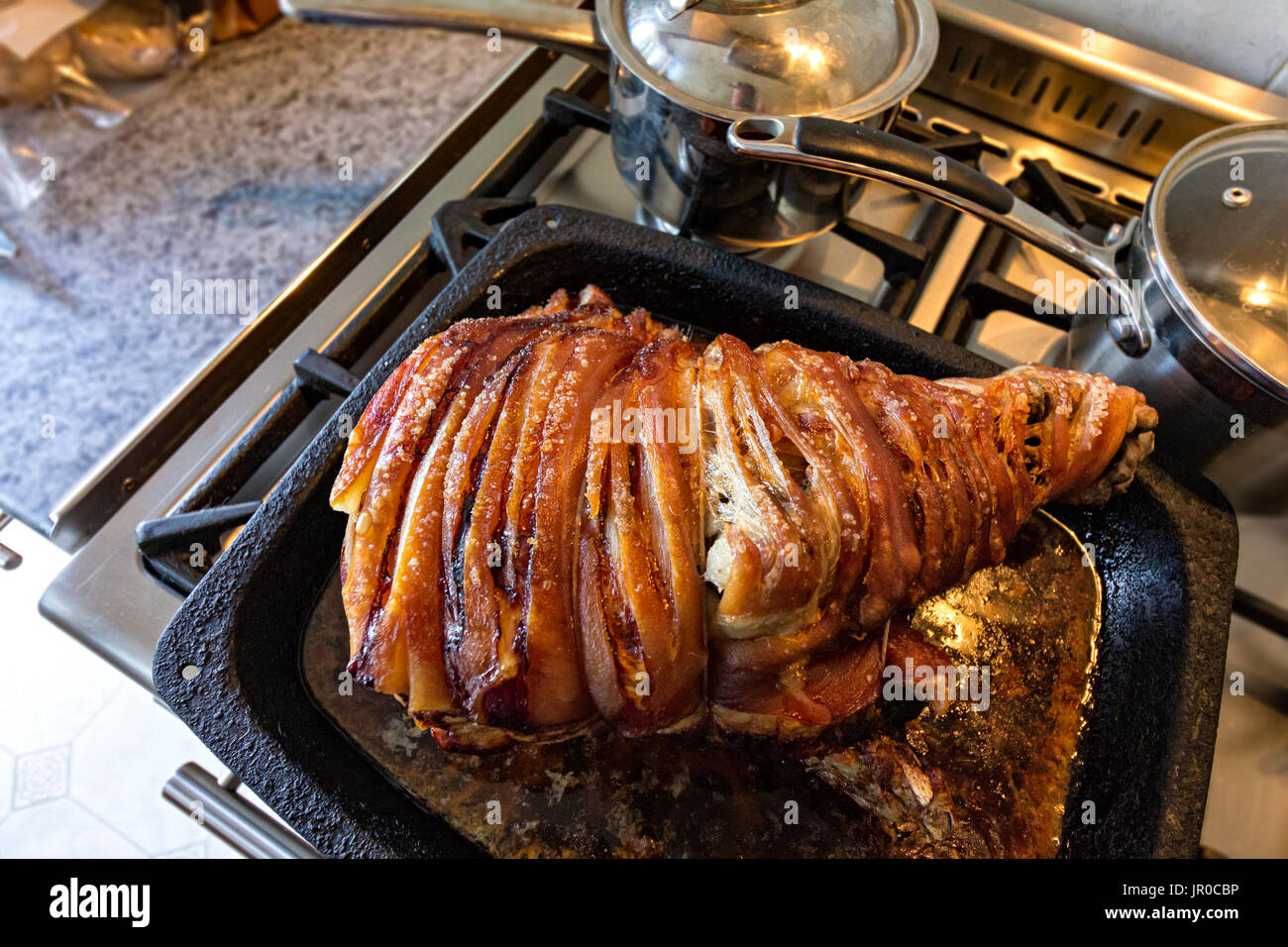 Roast hand of pork Stock Photo Alamy