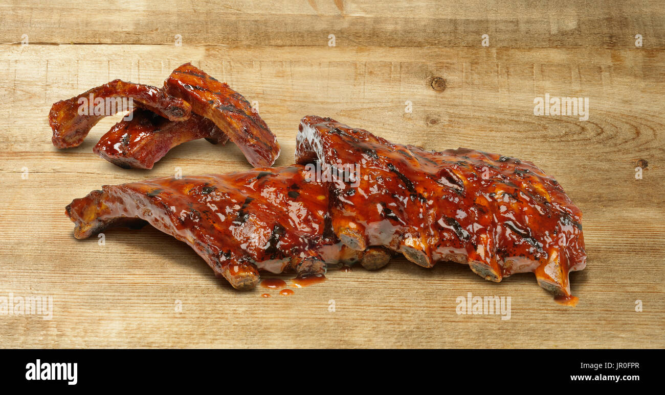 Rack Ribs With Sauce On A Wooden Counter Stock Photo