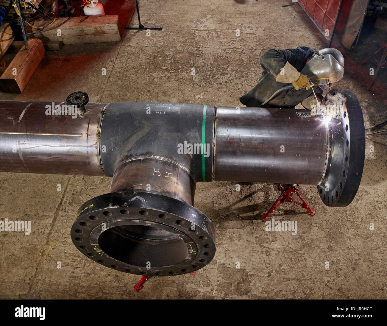 A Welder Works On Welding The Joints Of Pipes; Edmonton, Alberta