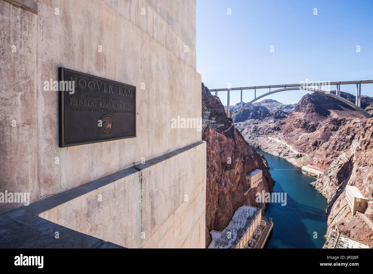 A Plaque Commemorating The Construction Of The Hoover Dam Is Displayed At The Hoover Dam Lookout With A View Of The Mike O'callaghan-Pat Tillman Me... Stock Photo