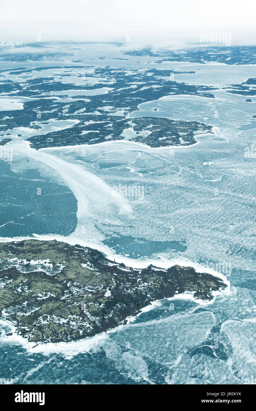 Aerial View Of The Frozen Water And Landscape In Winter; Alaska, United States Of America Stock Photo